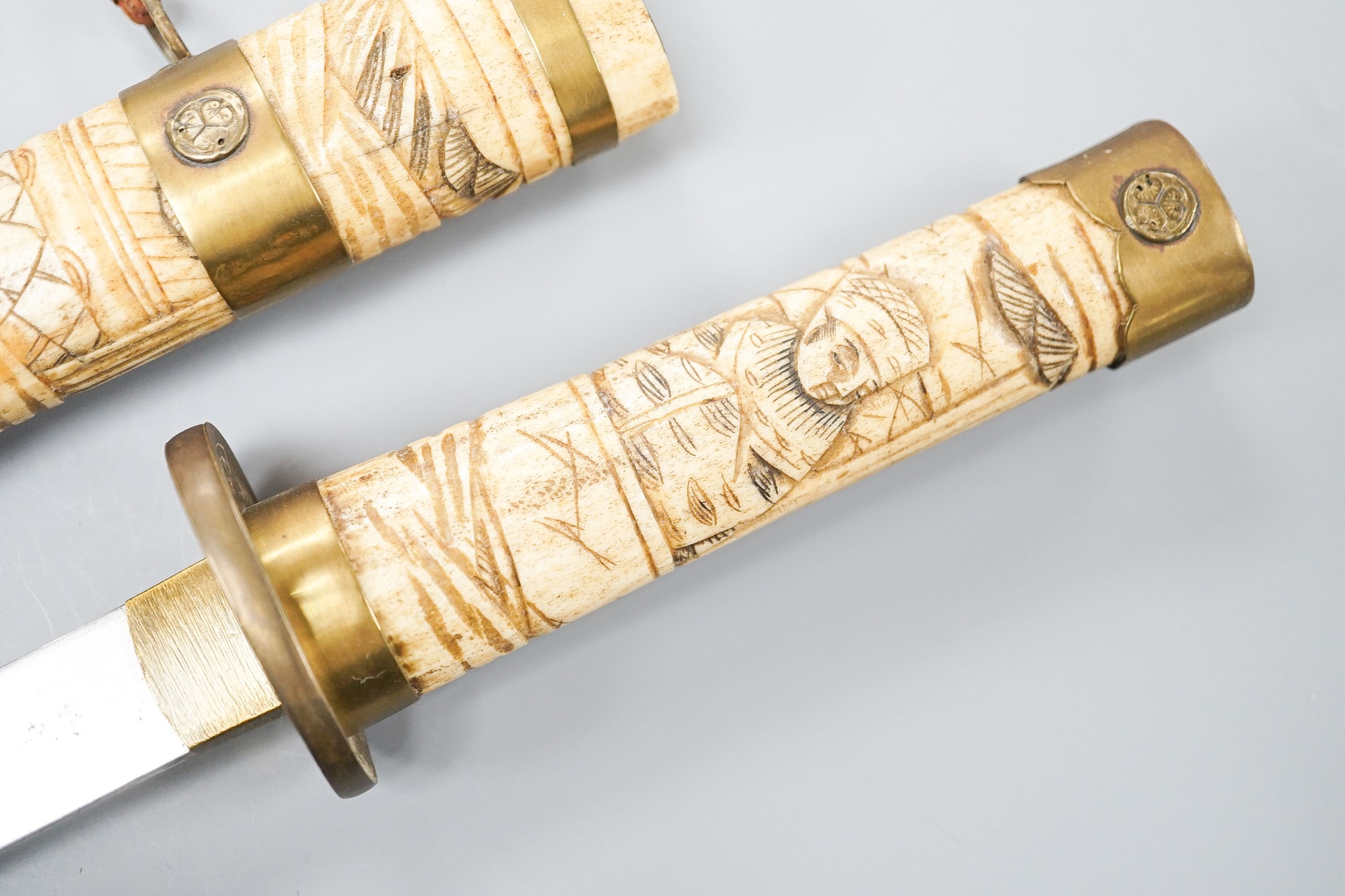 A 20th century bone and brass mounted tanto sword